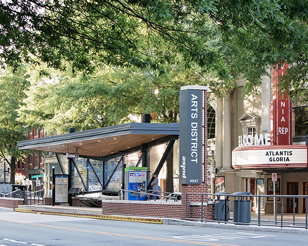 Station at the downtown arts district with beautiful trees overhead.