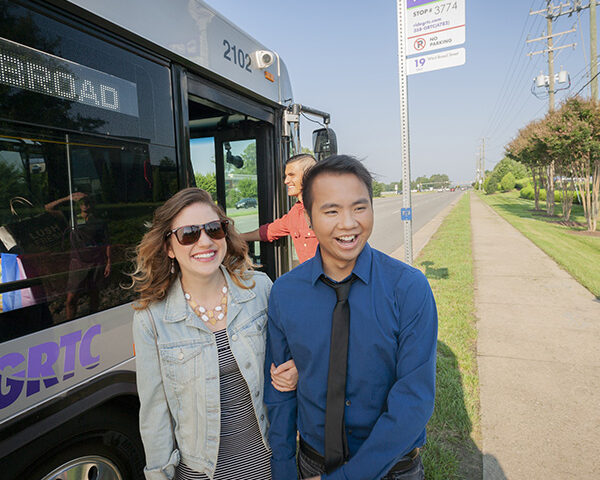 A couple enjoy the day after taking the bus downtown.