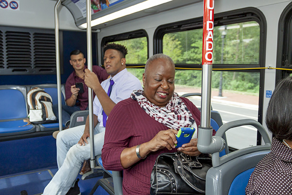 Passengers aboard the bus enjoying their ride.