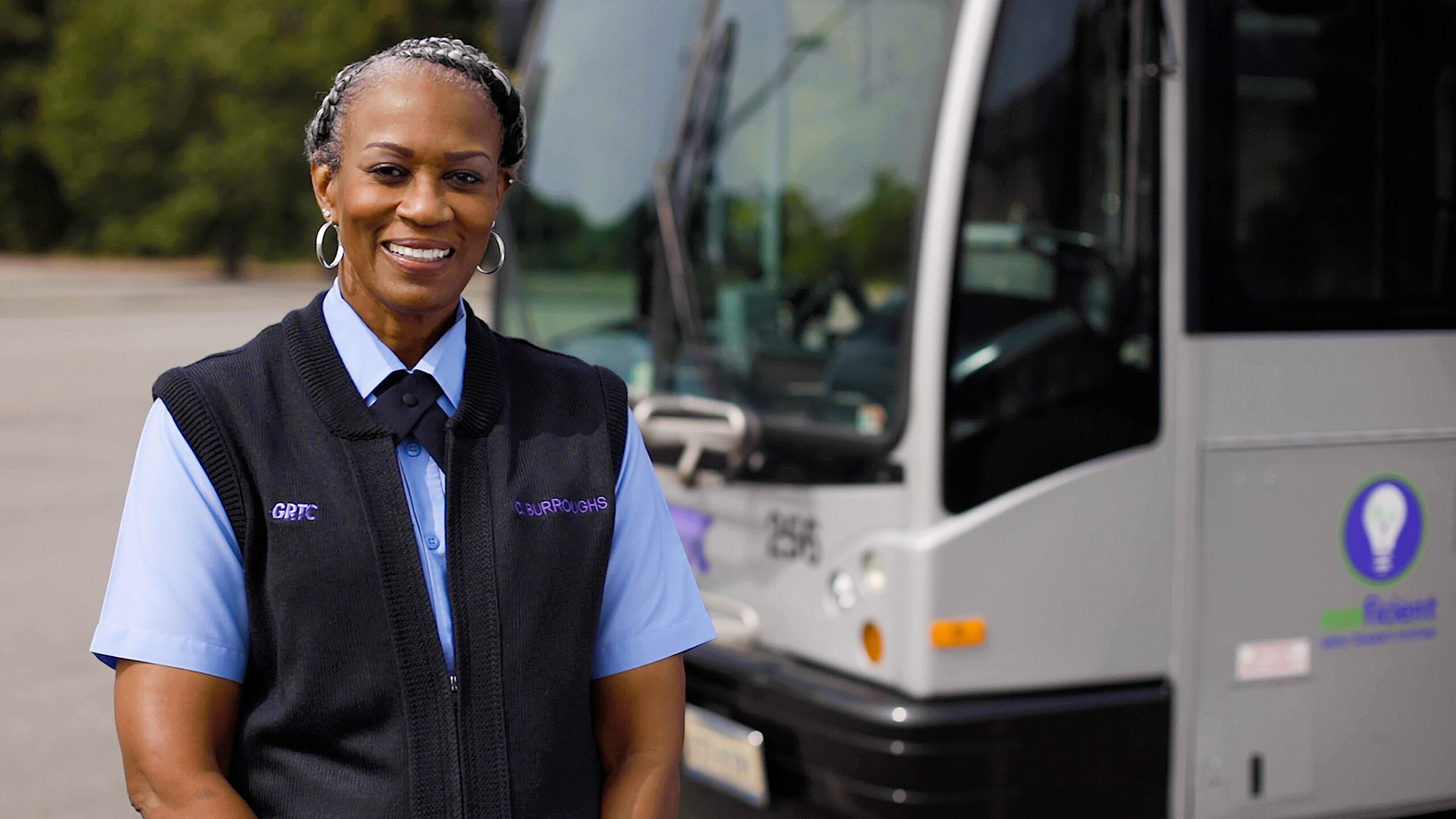 Operator Cheryl outside a GRTC bus