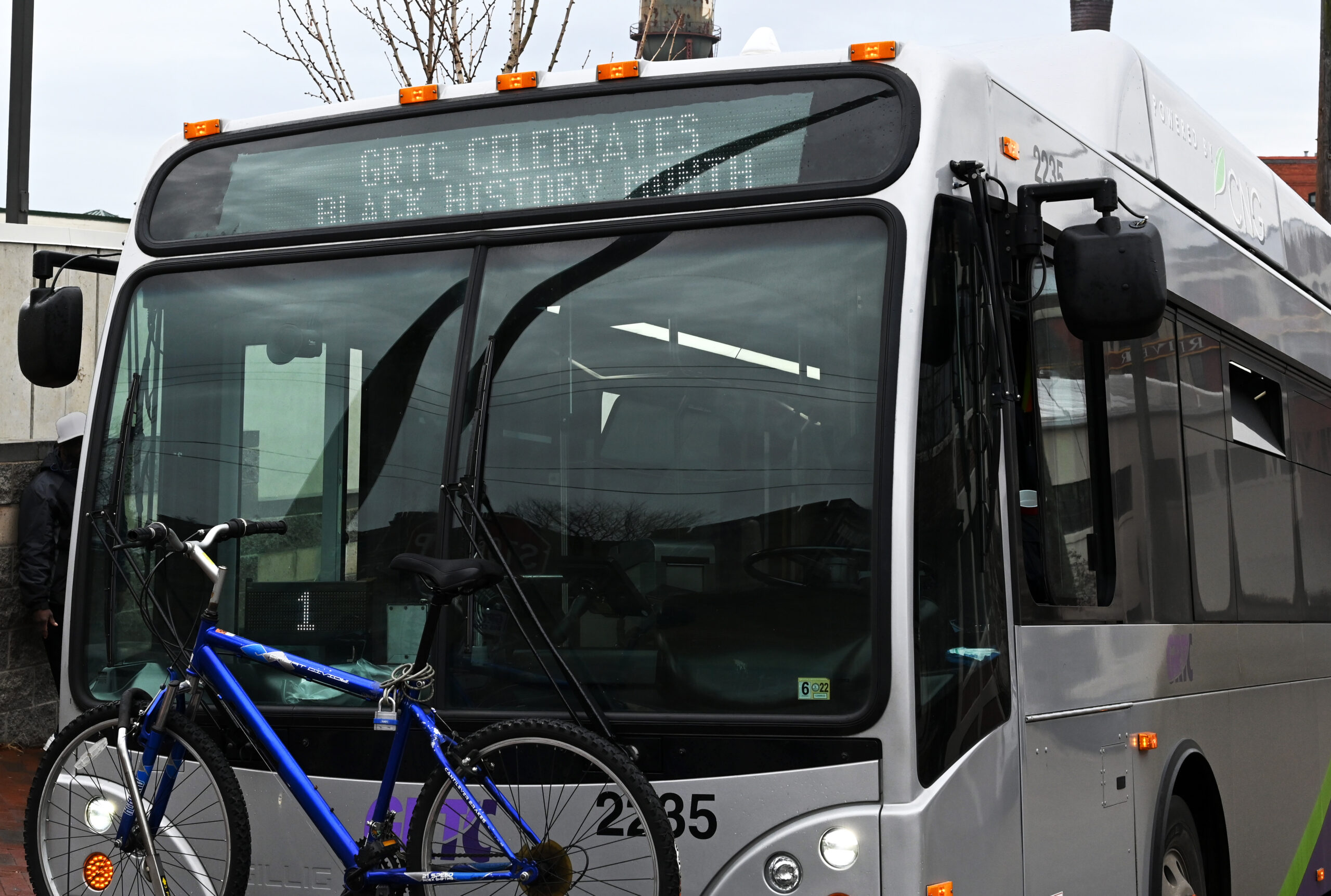 GRTC bus with a bike on the rack, showing the special message, “GRTC CELEBRATES BLACK HISTORY MONTH.”