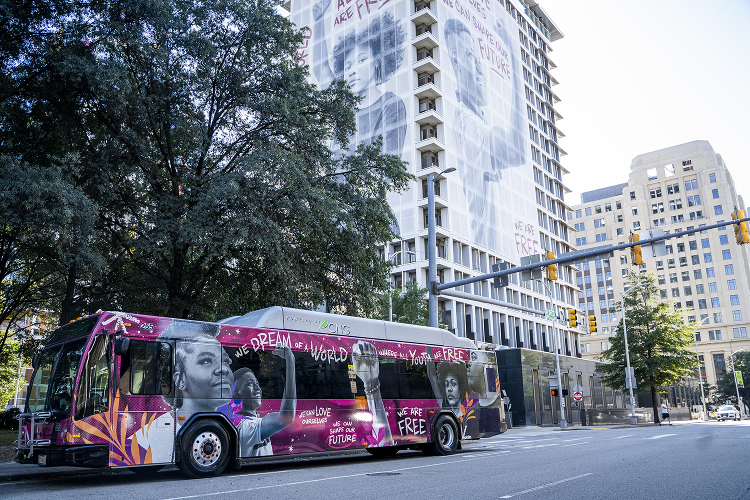 A bus travels down the streetDescription automatically generated