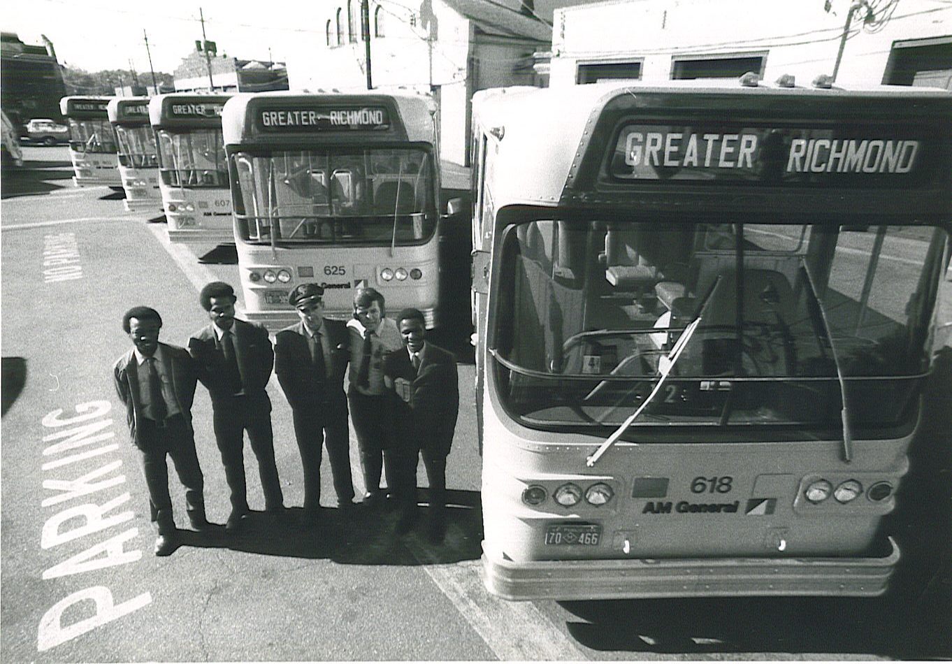 GRTC buses and five operators shown outside the old Cary St. Bus Barn, year unknown.