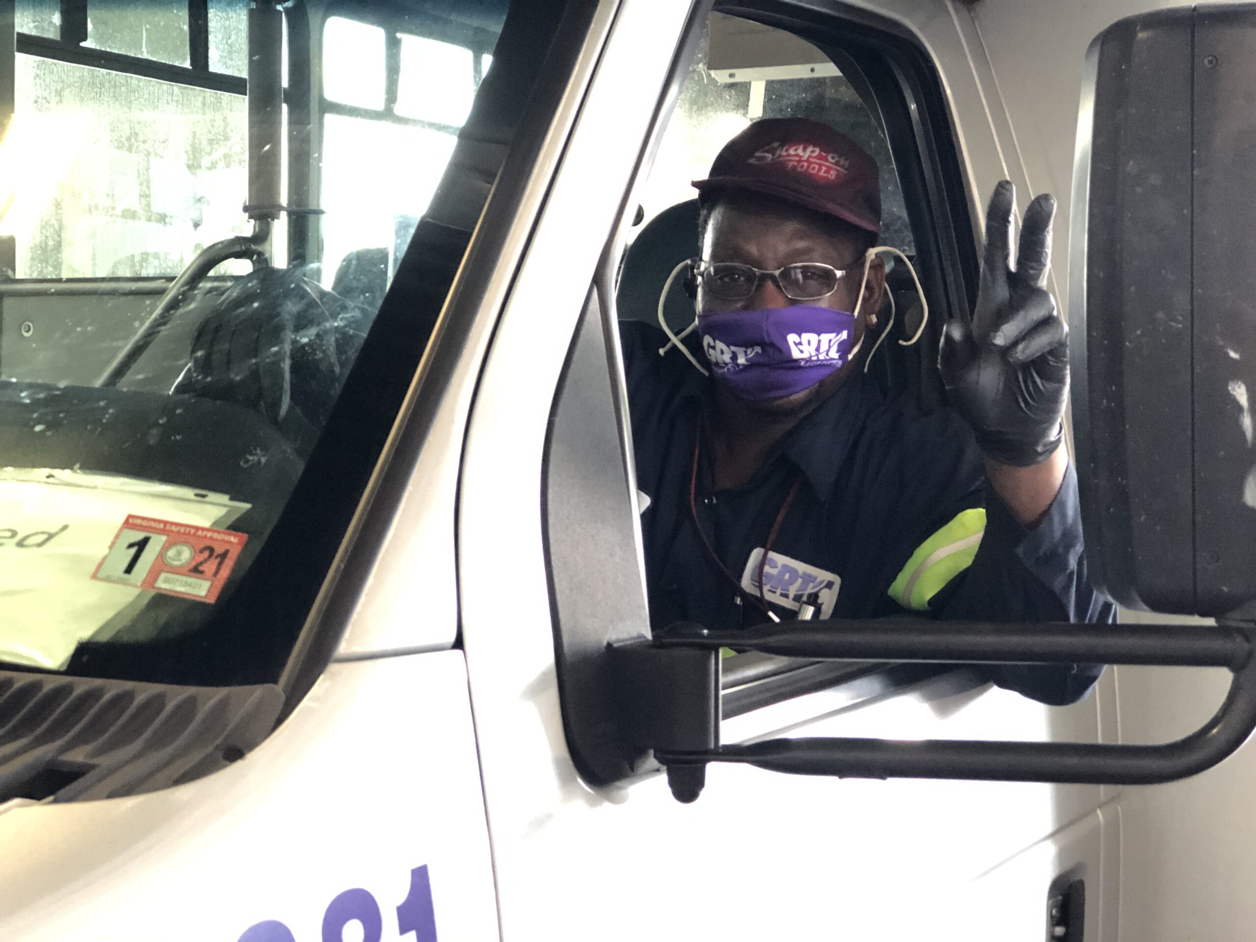 Bus operator wearing GRTC face mask