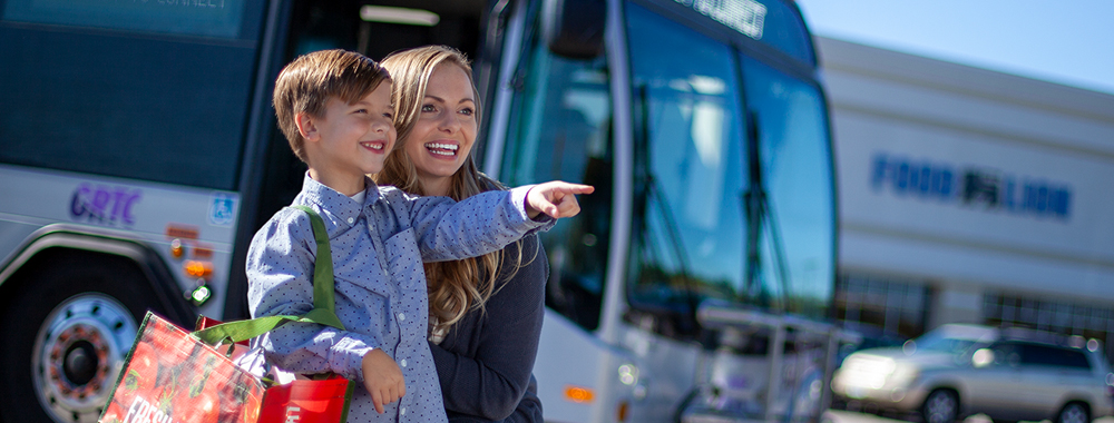 Mother and son taking the bus to buy groceries