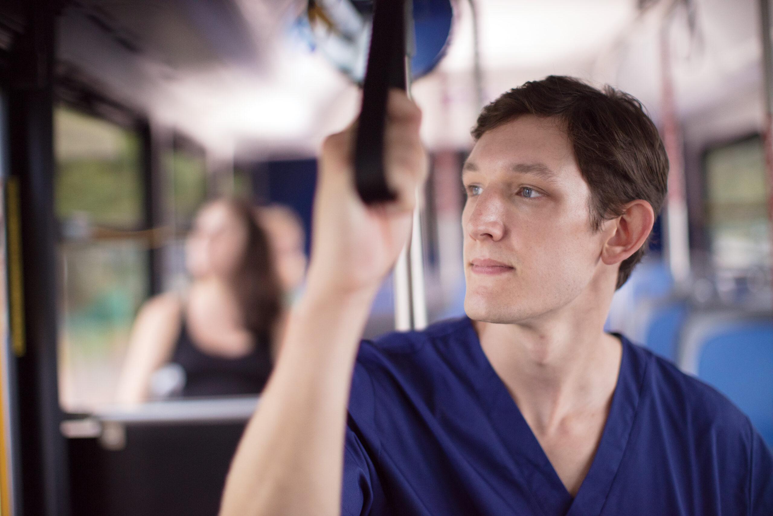 A nurse takes the bus to work