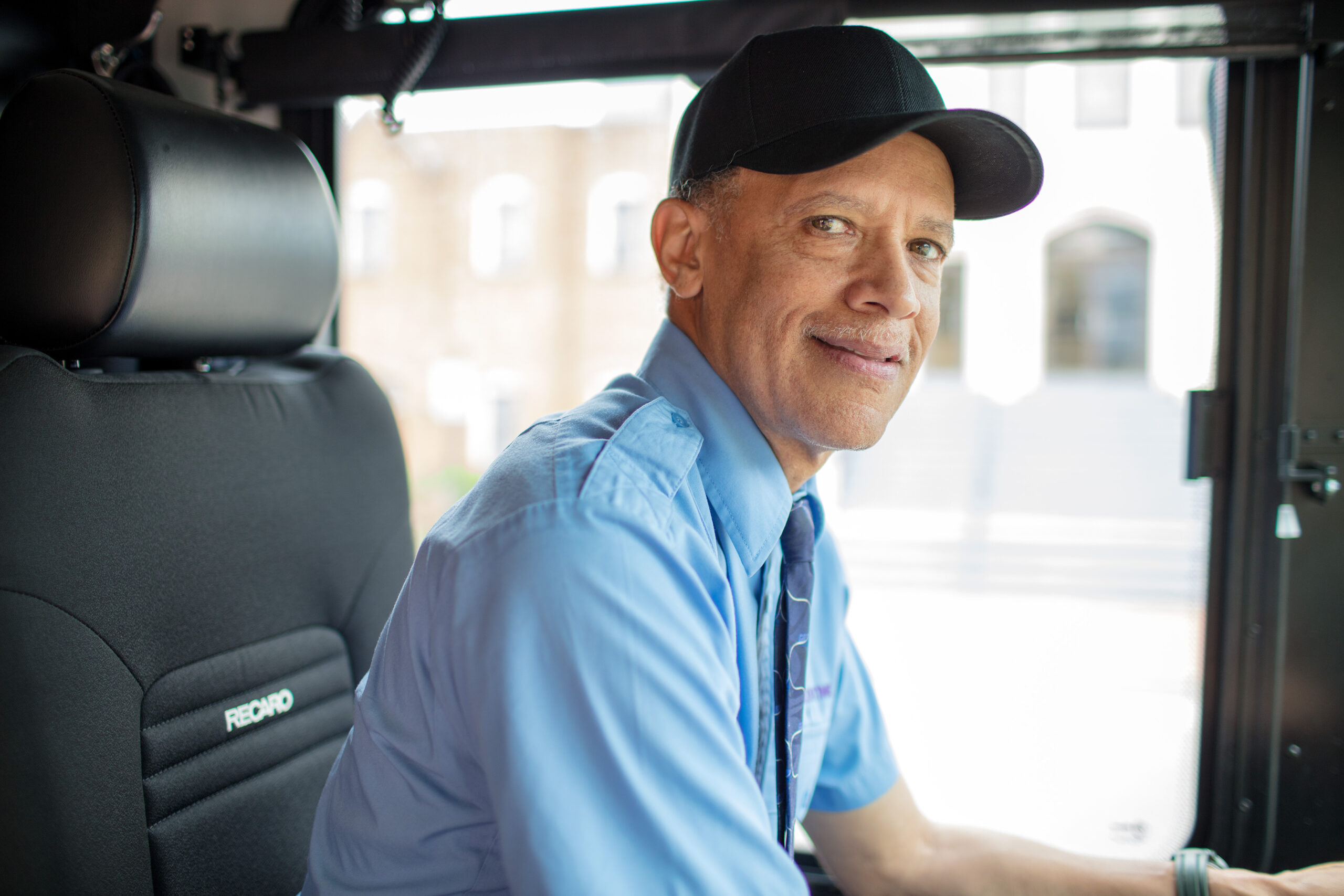 A bus operator in uniform